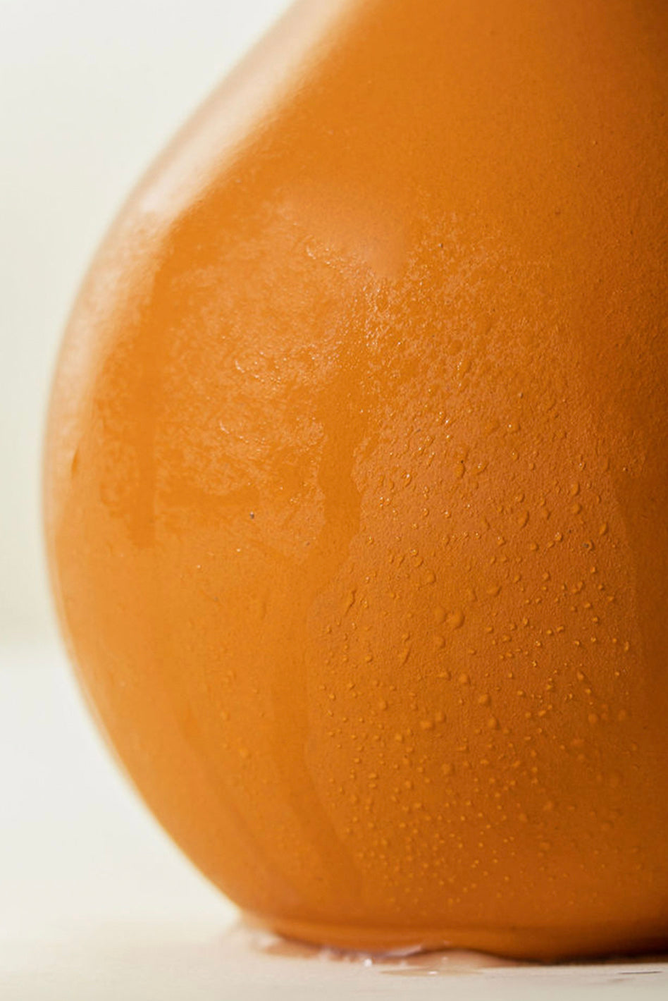 An Oya watering pot is porous for easy garden watering